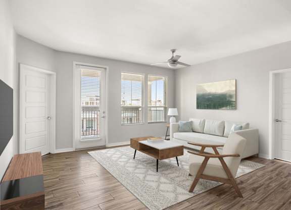A living room with a white couch, a wooden coffee table, and a painting on the wall.