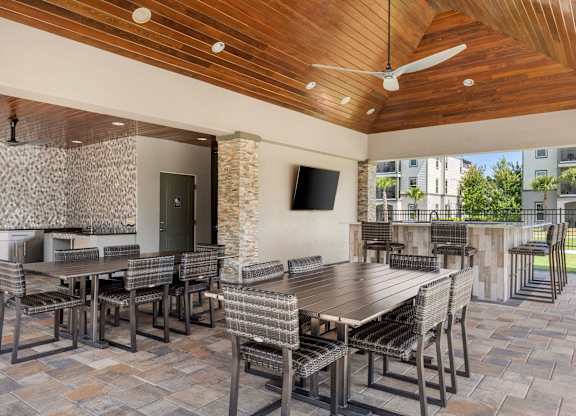 A patio with a table and chairs.