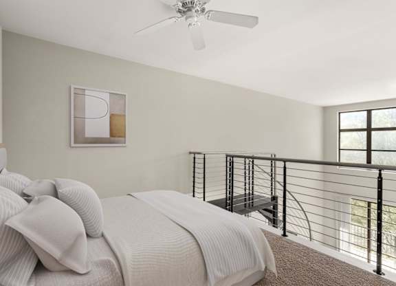 A bedroom with a bed, a ceiling fan, and a balcony.