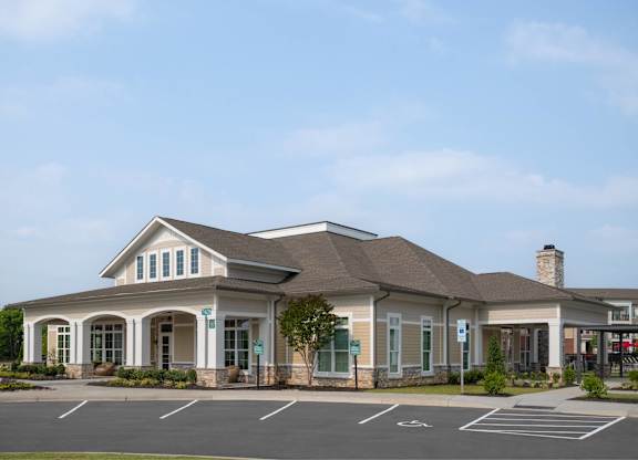 A building with a parking lot in front of it.
