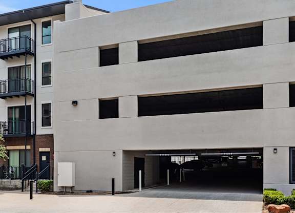 A modern building with a large garage door.