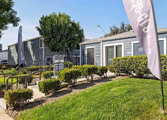 A row of houses with a sign that says