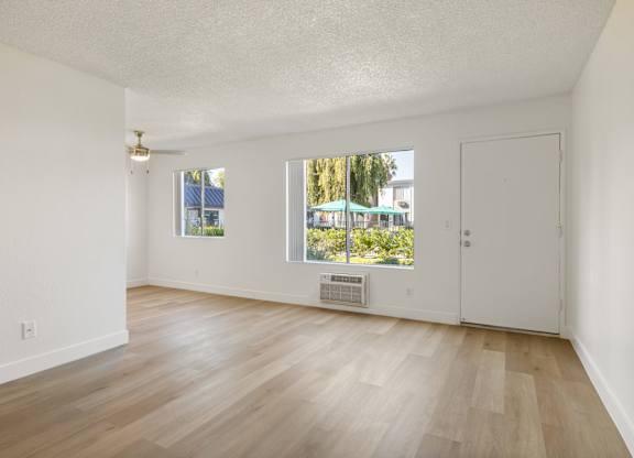A room with a window and a door.