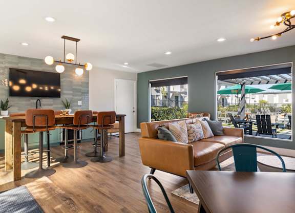 A modern dining room with a wooden table and chairs.