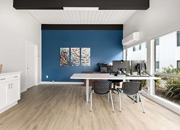 A room with a table and chairs in it.