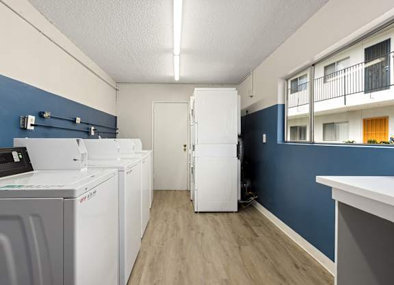 A laundry room with a washer and dryer.