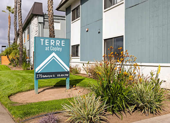 A sign for Terre at Copley is in front of a building.