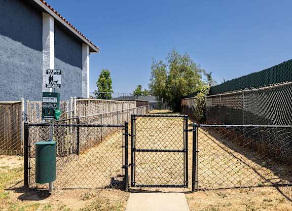 A gate blocks the entrance to a fenced area.