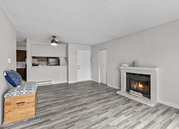A room with a fireplace and a bed.