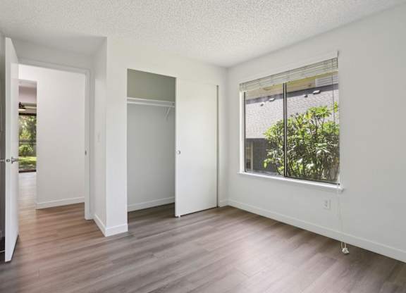 A room with a window and a door.