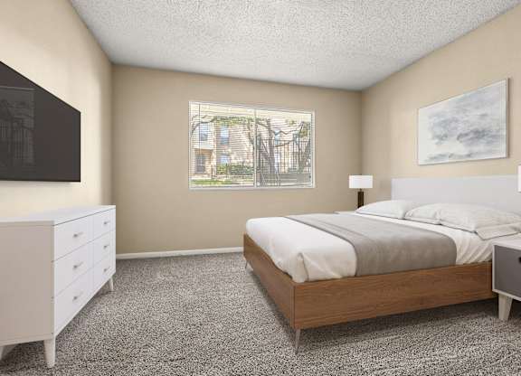 A bedroom with a bed, nightstand, and dresser.