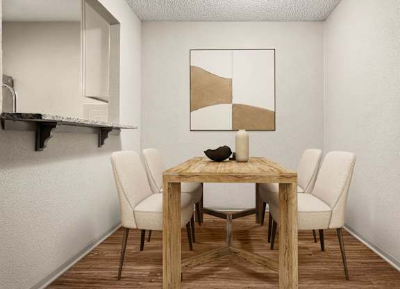 A dining table with four chairs and a bowl on top.