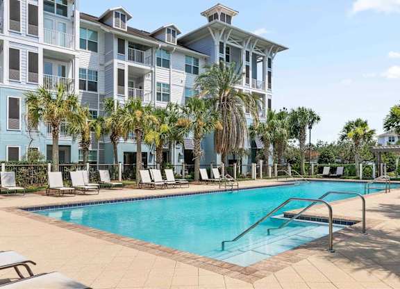 A pool near a building.