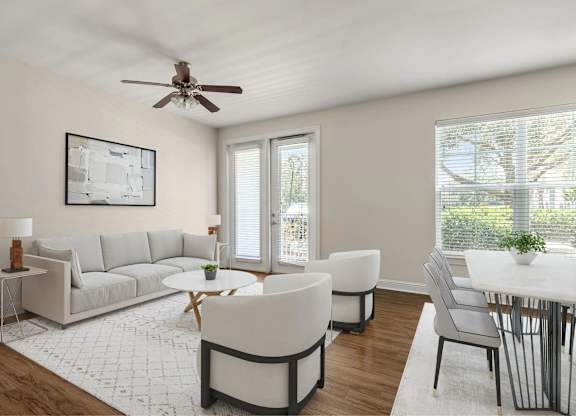 A living area with a couch and chairs.