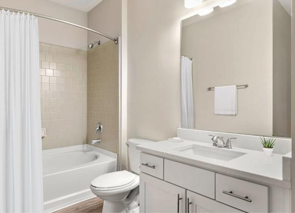 A bathroom with a bathtub.