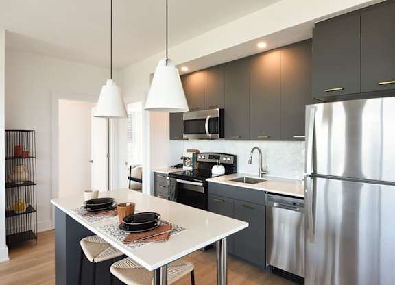Contemporary kitchen with pendant lighting and island at 929 Richmond Apartments, Ottawa, K2B 6R1