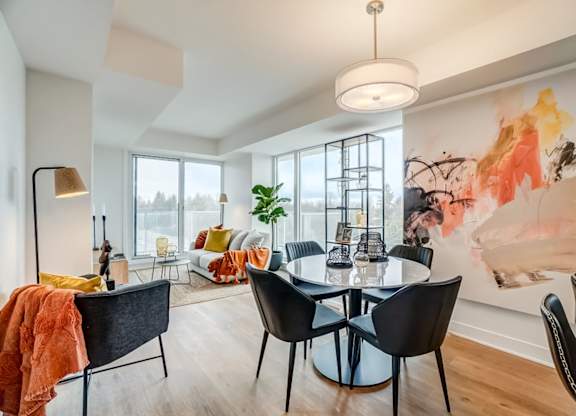 Modern dining area with contemporary furniture and artwork at Baseline Apartments, Ottawa, ON K2H 0C9