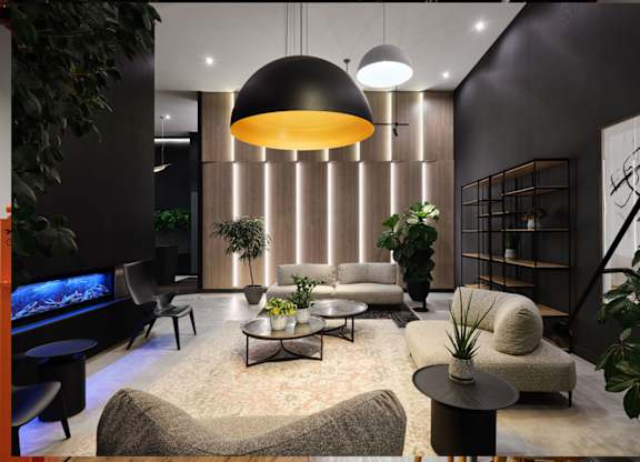 Contemporary living room with pendant lighting and plants at Baseline Apartments, Ottawa, ON