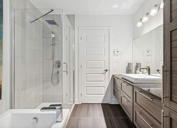Modern bathroom with glass shower and vanity at Horizon Apartments, Gatineau, QC J9A 0G9