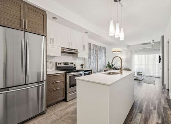 Modern kitchen with stainless steel appliances at Horizon Apartments, Gatineau, QC