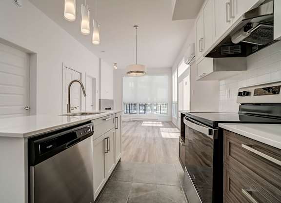 Galley kitchen with stainless steel appliances at Horizon Apartments, Quebec