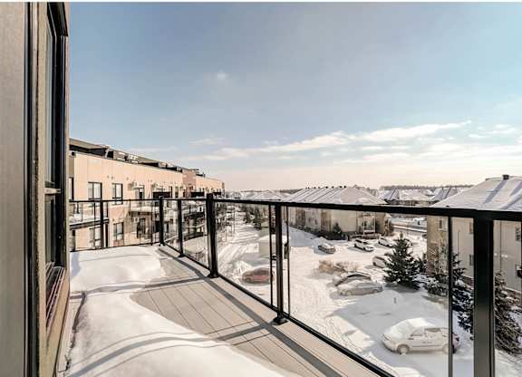 Balcony view overlooking snowy residential courtyard at Horizon Apartments, Gatineau, QC J9A 0G9