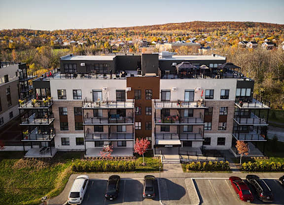 Modern apartment building with rooftop terrace at Horizon Apartments, Gatineau, QC