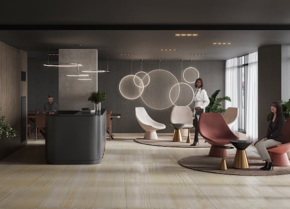 A modern office lobby with a reception desk and comfortable seating areas at Petries Landing I Apartments , Ontario, K4A 1K4