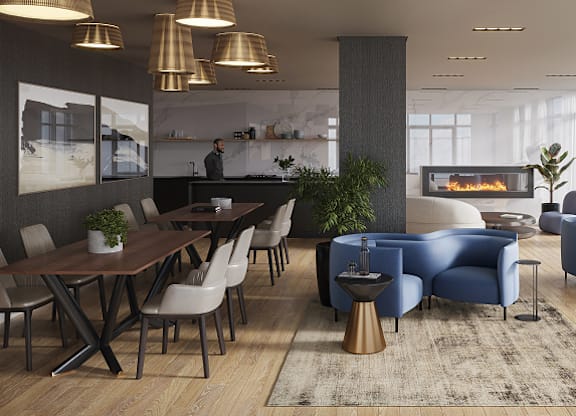 A modern dining room with a fireplace and a person standing by the counter at Petries Landing I Apartments , Ottawa, Ontario