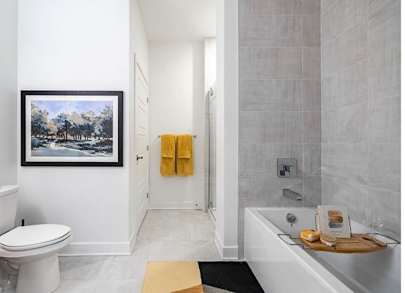 Modern bathroom with soaking tub and tiled shower at Petries Landing II Apartments, Ontario, K4A 0S8