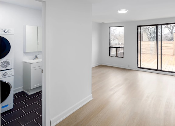A modern laundry room with a washer and dryer.