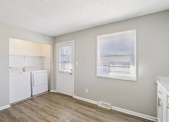 A laundry room with a washer and dryer.