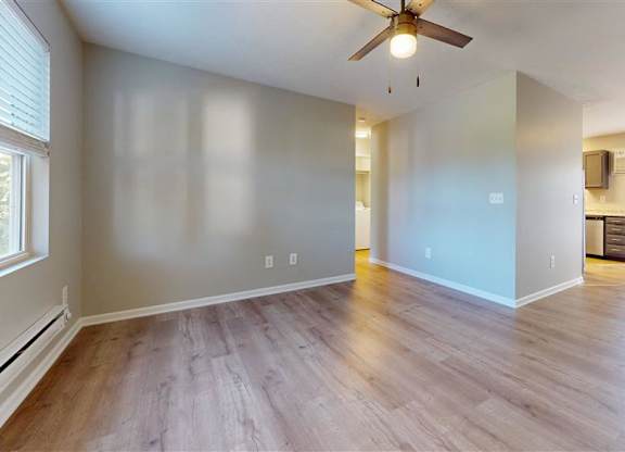 A room with a ceiling fan and light fixture, and a window with blinds at Ridgeview Apartments, Indiana, 46060
