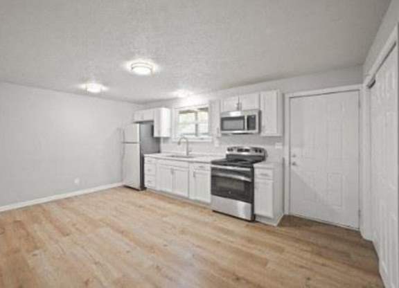 Kitchen With White Cabinets at Windmill, Indiana