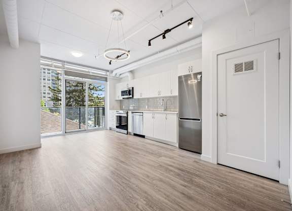 Modern studio apartment with open kitchen at Ophelia on Queen Apartments, Kitchener, Ontario