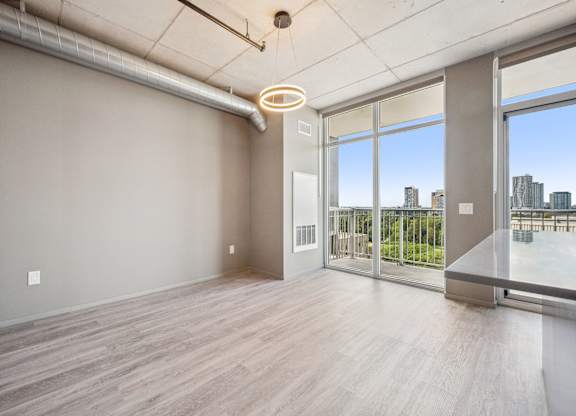Spacious room with balcony and city views at Ophelia on Queen Apartments, Kitchener, ON N2G 0E7