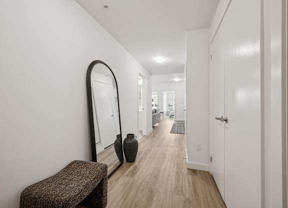 Modern hallway with woodstyle flooring at The Maverick Apartments, Kitchener, N2H 0E3