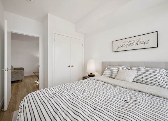 Bedroom with bed at The Maverick Apartments, Kitchener, ON N2H 0E3