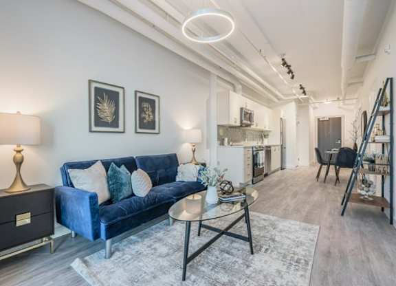 Living Room with Blue Couch at Ophelia on Queen Apartments, Kitchener, ON, N2G 0E7