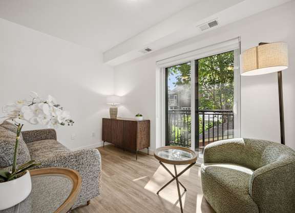 Modern living room with balcony access at The Maverick Apartments, Kitchener