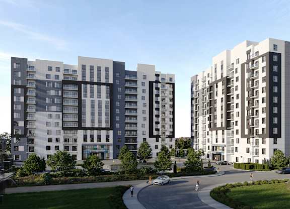 A modern apartment complex with a curved driveway in front at Roxy Apartments, Hamilton, ON