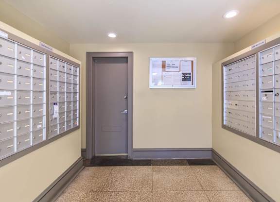 A hallway with a wall of mailboxes at Sheridan Park, Chicago