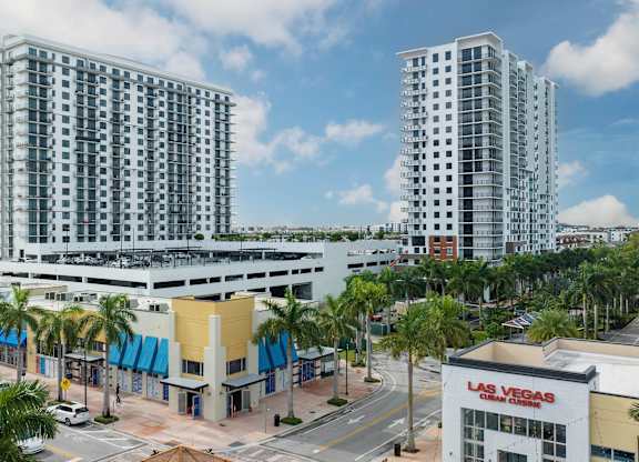 Two tall buildings are in the background of a Las Vegas sign. at Palma, Doral, FL, 33166