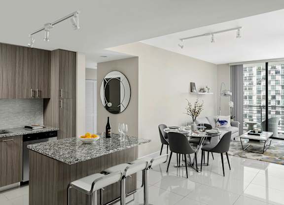 A modern kitchen with a dining  at Palma, Doral, FL