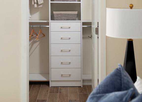 A white wardrobe with a white bed in front of it. at Palma, Florida, 33166