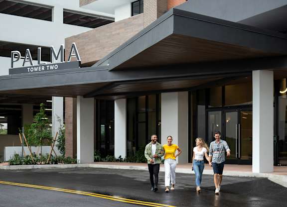 Four people are walking  at Palma, Doral, FL, 33166