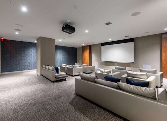 A modern living room with grey carpet and white furniture. at Palma, Doral, Florida