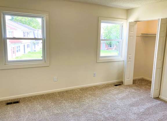 A room with a window and a door.
