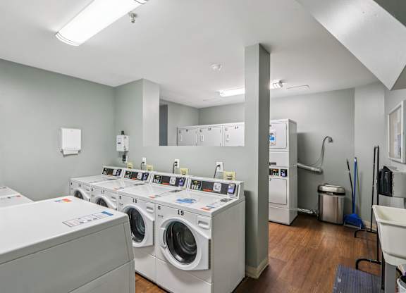 A row of washing machines in a laundromat.