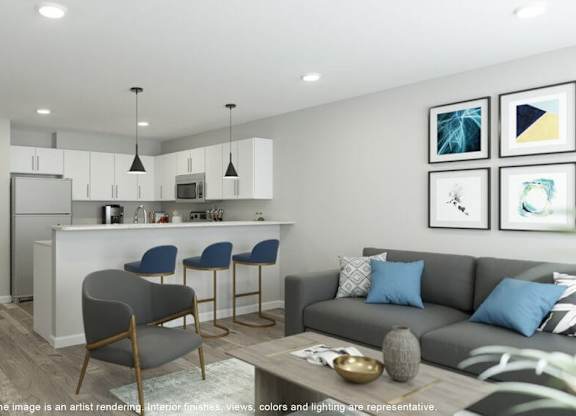 A modern living room with a grey sofa and a bar area.
